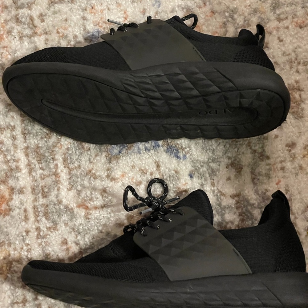 Black ALDO sneakers with decorative matte accents